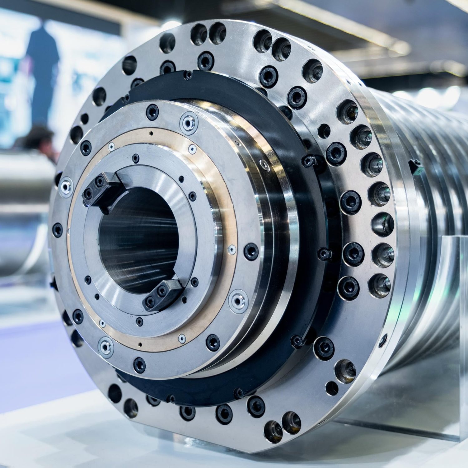 Precision metal machine part showcasing industrial engineering at a technology exhibition