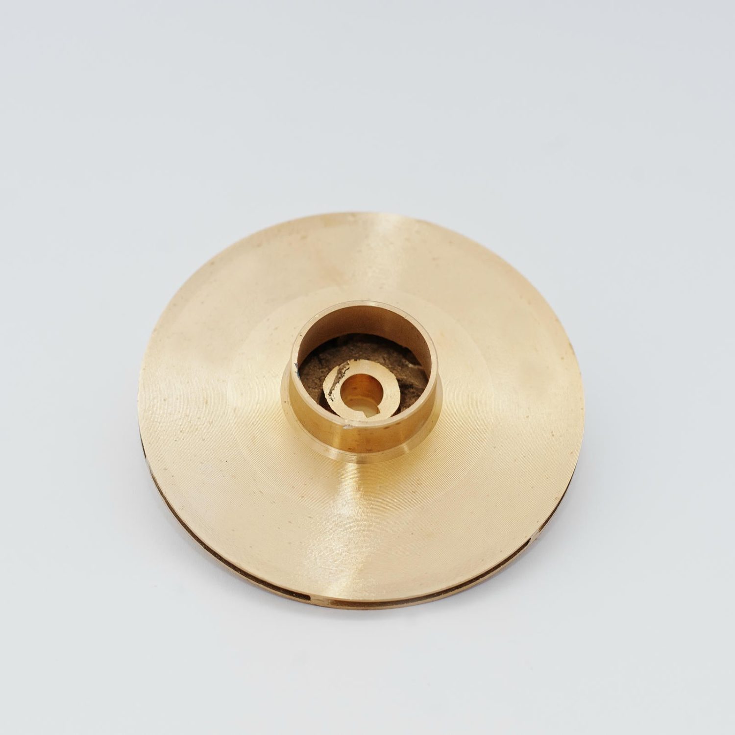 Spare part round disc for water pump isolated on white.