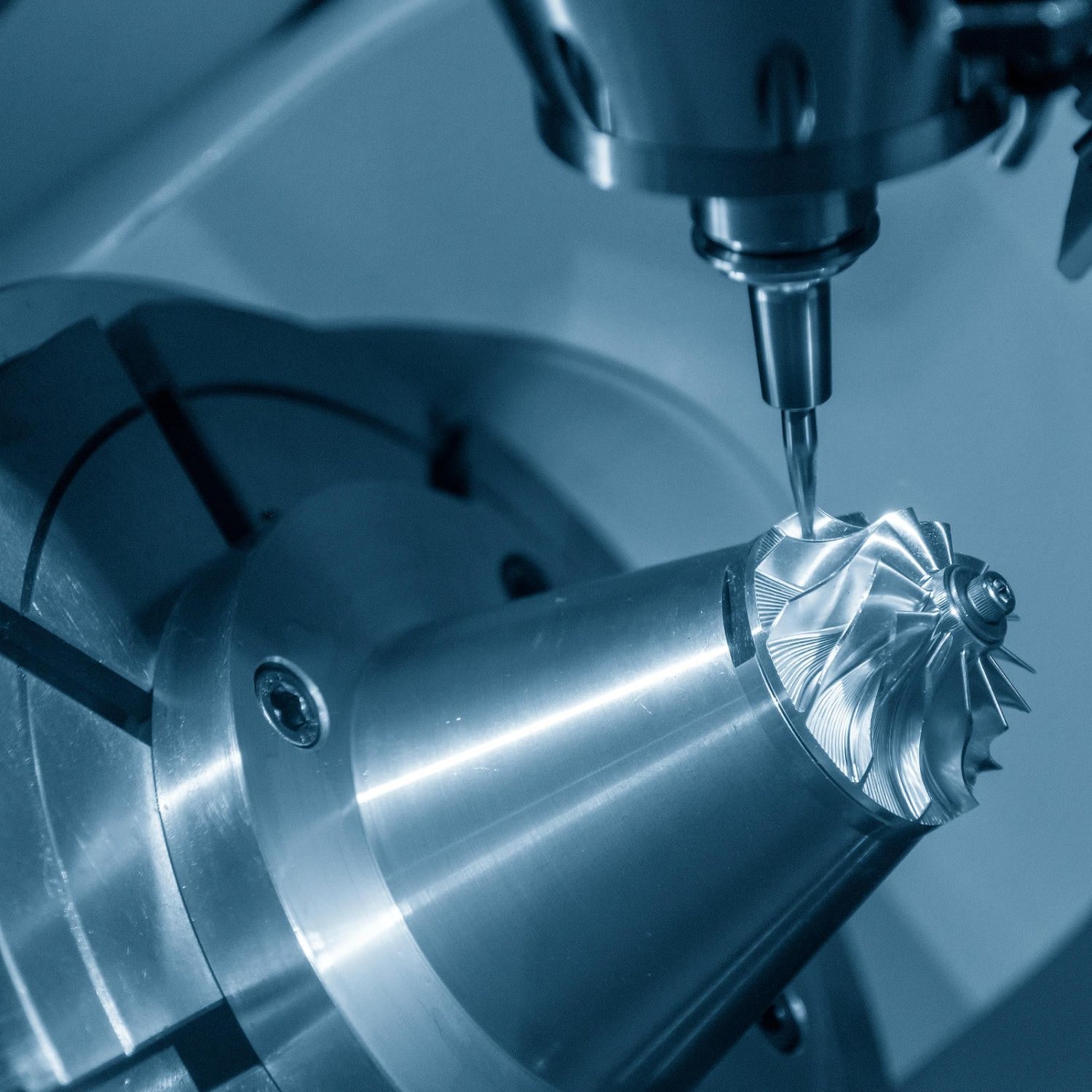 The 5-axis CNC milling machine cutting the turbine part with the taper ball endmill tool.The table tilt type of 5-axis machining center cutting the aero space parts.