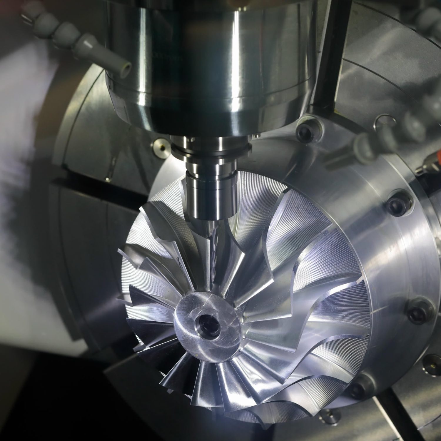 Milling process using 5-axis CNC machining center. Selective focus.